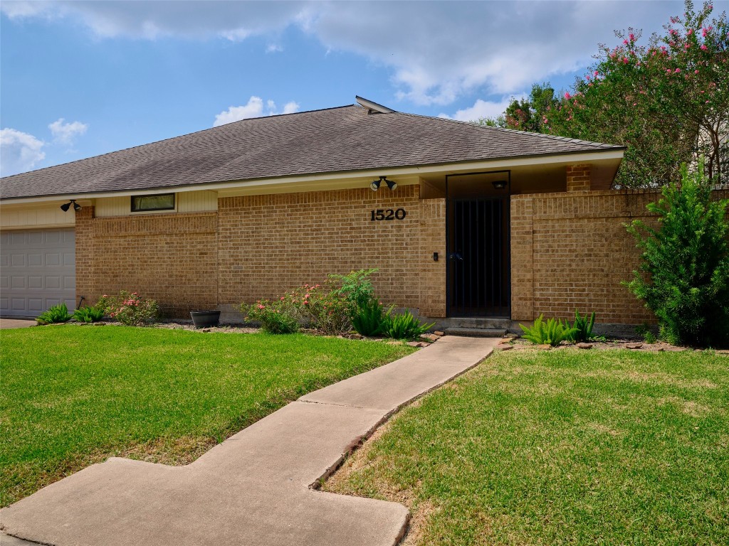 1520 Crestmont Street Wharton, TX 77488 - Photo 4 of 38 a view of a house with a yard
