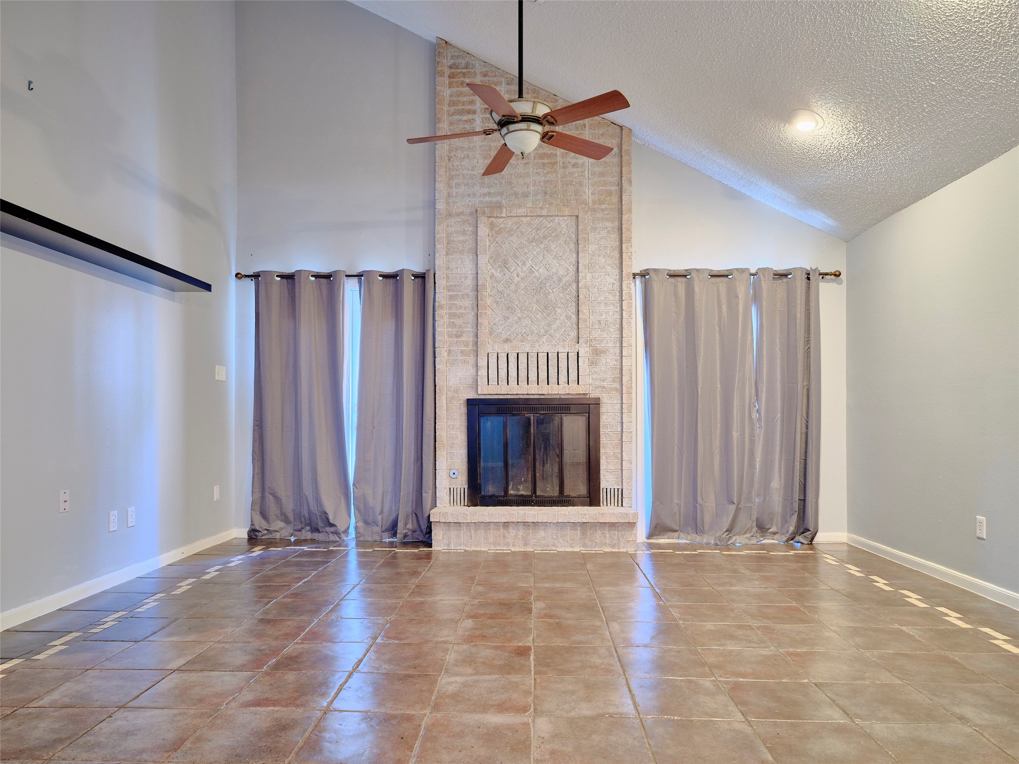 1520 Crestmont Street Wharton, TX 77488 - Photo 6 of 38 a view of a livingroom with a fireplace and window