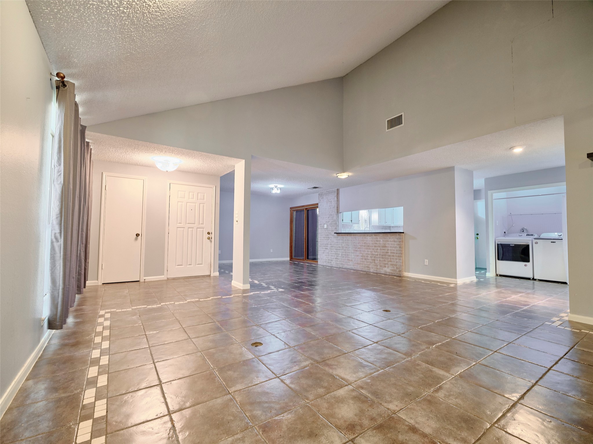 1520 Crestmont Street Wharton, TX 77488 - Photo 8 of 38 a view of a hallway with an empty room and fire place