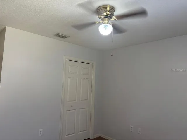 a bathroom with a sink mirror and a shower