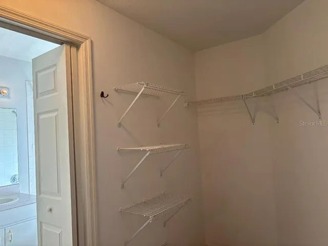 a bathroom with a window and a shower