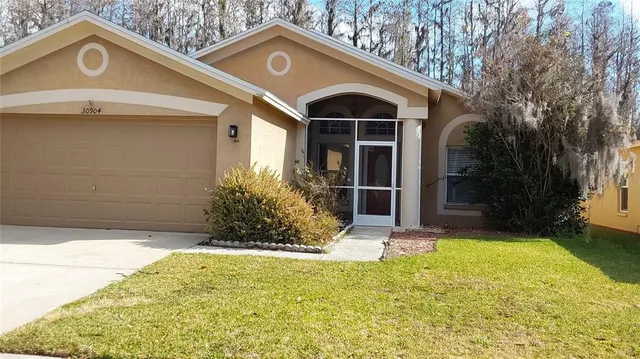 a view of a house with a yard