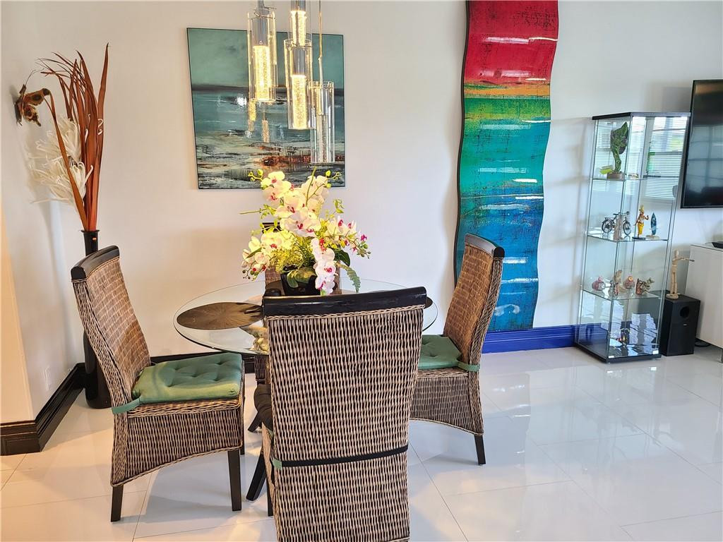 163 Suffolk F, Unit 163 Boca Raton, FL 33434 - Photo 15 of 34 a view of two chairs in the patio