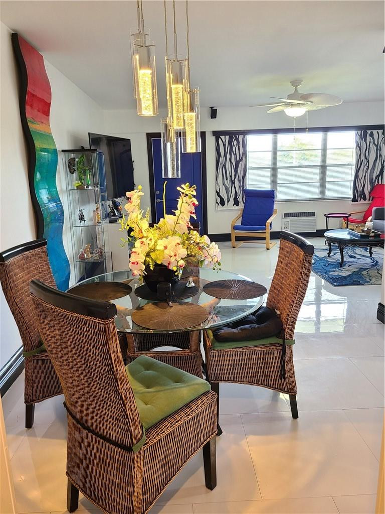 163 Suffolk F, Unit 163 Boca Raton, FL 33434 - Photo 16 of 34 a view of a dining room with furniture