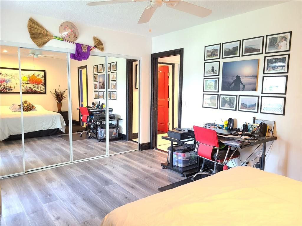163 Suffolk F, Unit 163 Boca Raton, FL 33434 - Photo 23 of 34 a bedroom with furniture and a large window