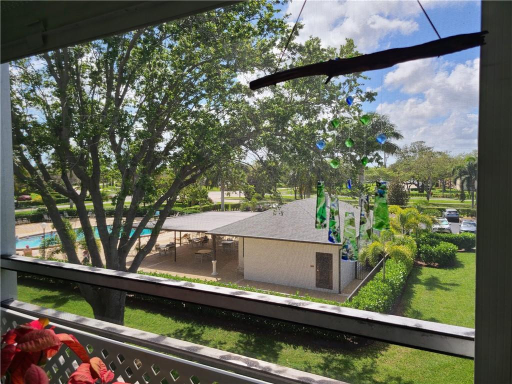 163 Suffolk F, Unit 163 Boca Raton, FL 33434 - Photo 30 of 34 swimming pool view from a window