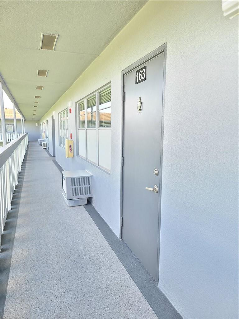 163 Suffolk F, Unit 163 Boca Raton, FL 33434 - Photo 34 of 34 a view of an entryway with stairs