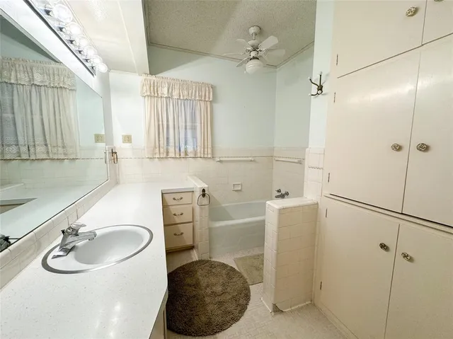 a bathroom with a sink double vanity and a mirror
