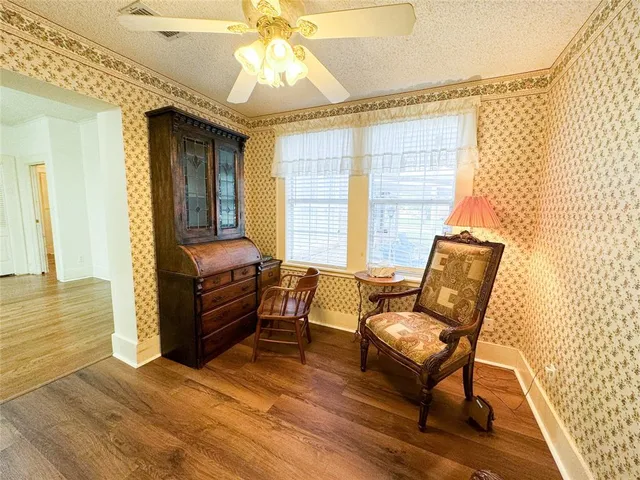 a bedroom with furniture and a window