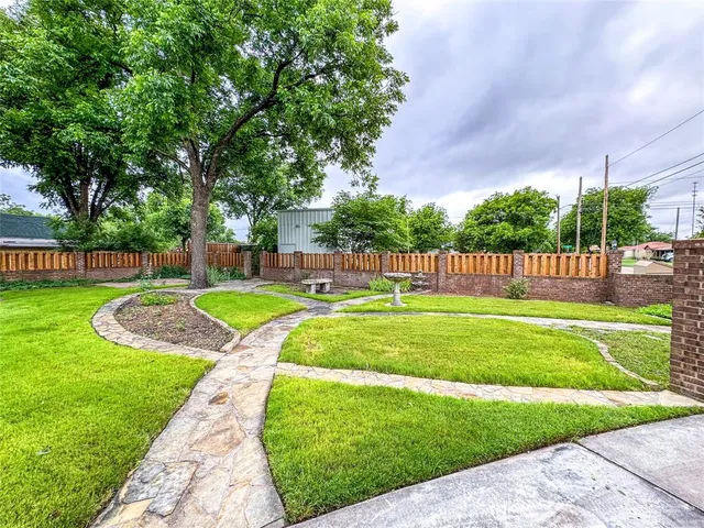 a view of a park with large trees