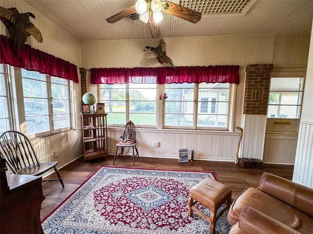 a living room with furniture and a window