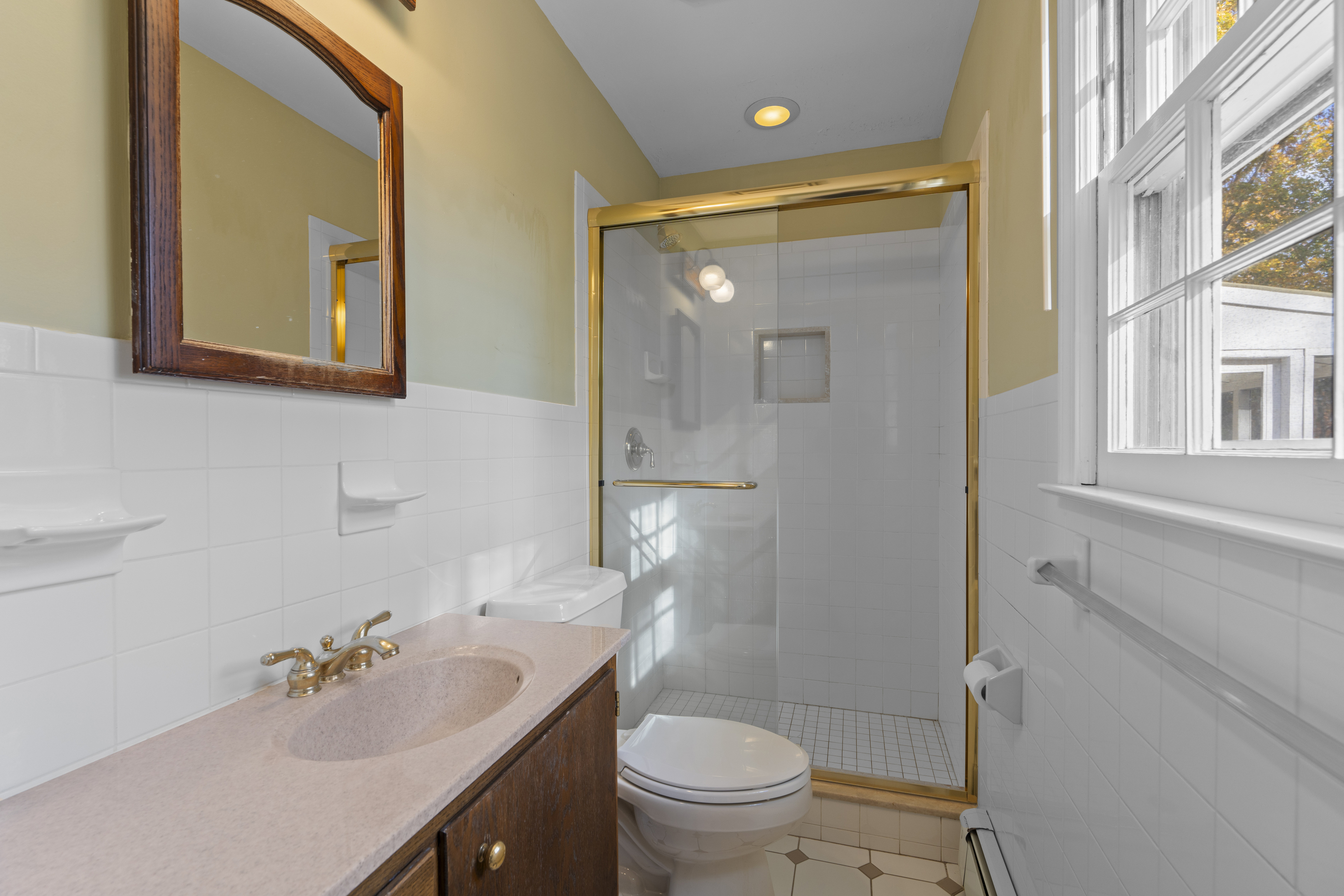 3 Parsell Lane Westport, CT 06880 - Photo 12 of 29 a bathroom with a sink a toilet and shower