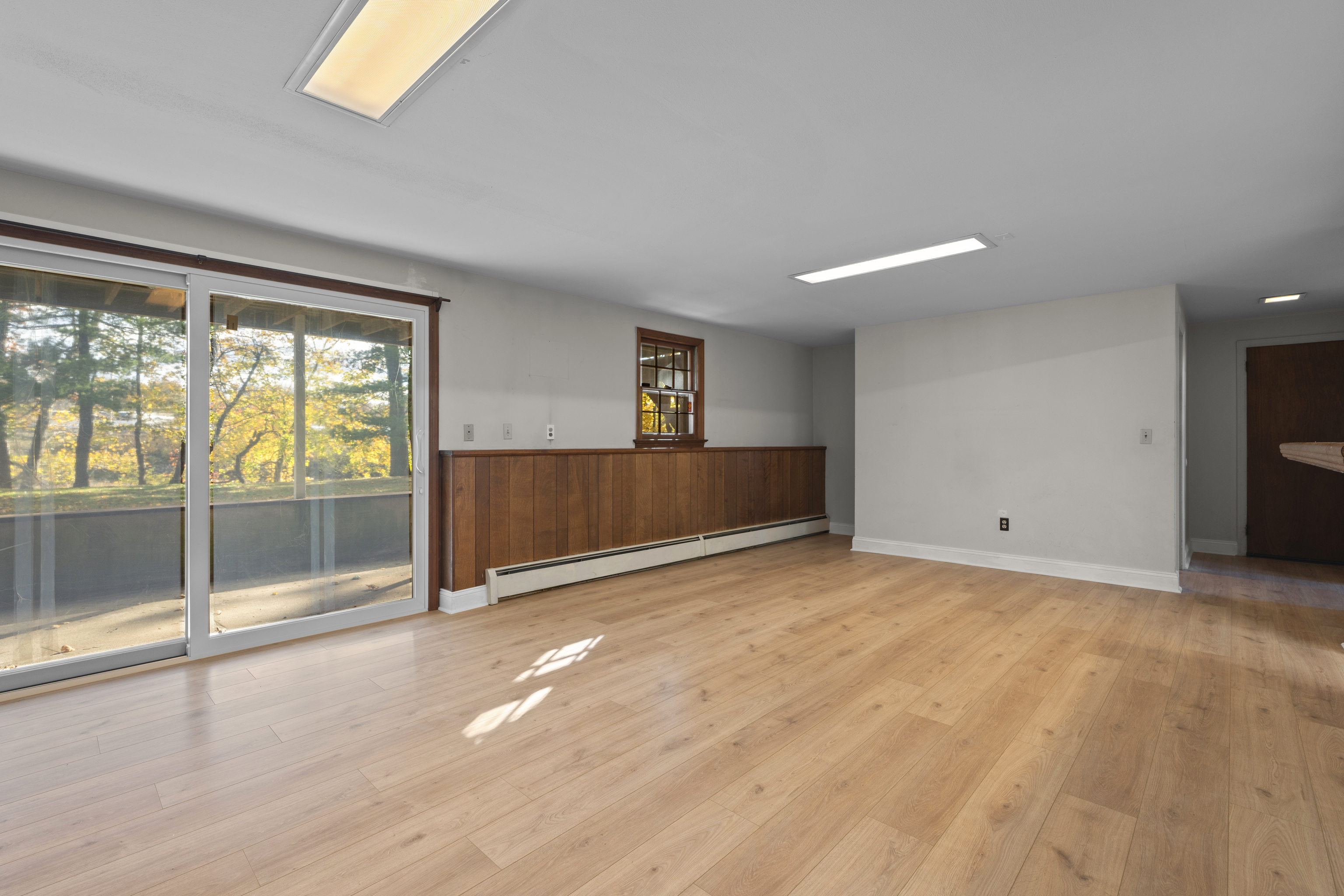 3 Parsell Lane Westport, CT 06880 - Photo 18 of 29 a view of an empty room with wooden floor and a window