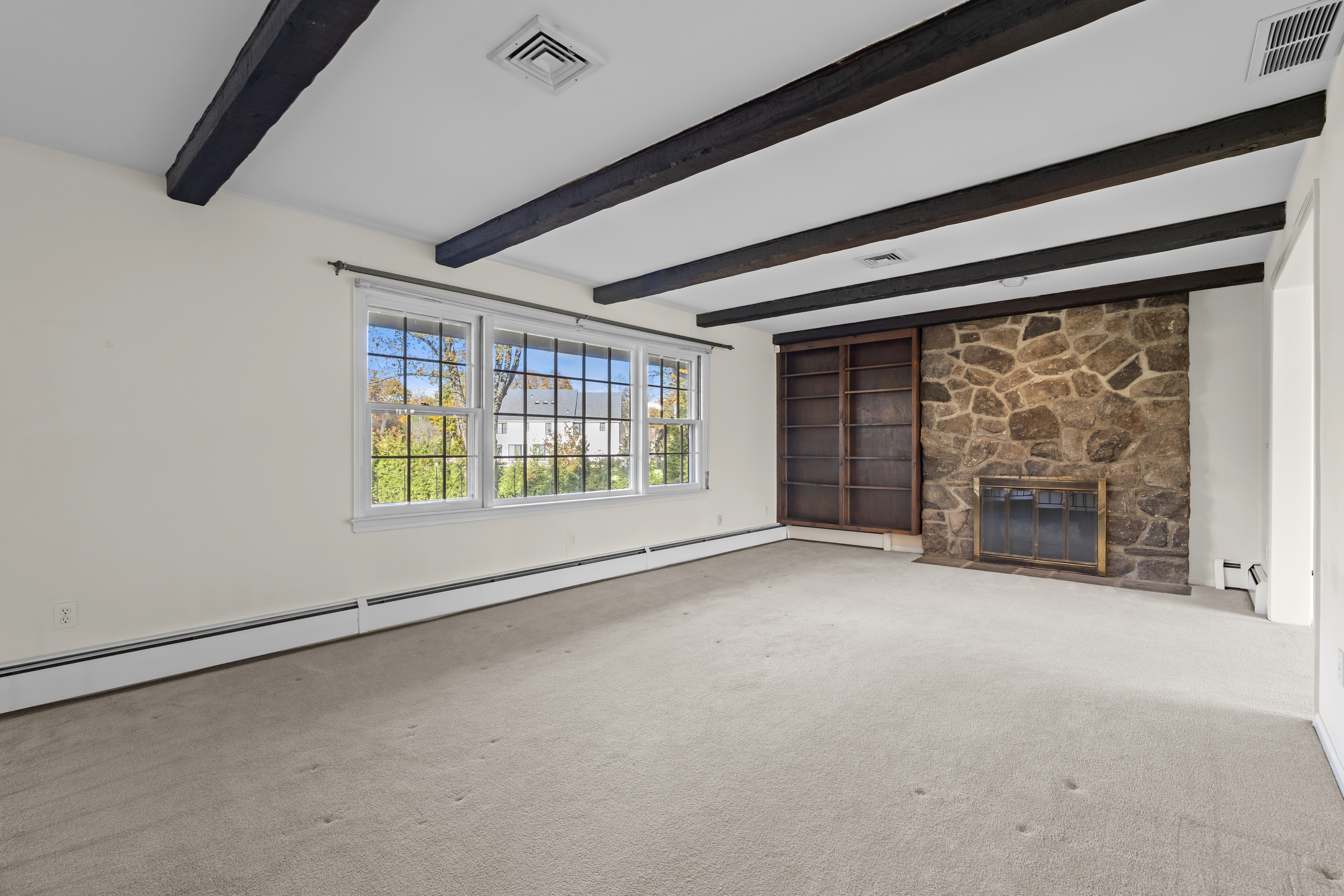 3 Parsell Lane Westport, CT 06880 - Photo 3 of 29 a view of an empty room with a fireplace and a window