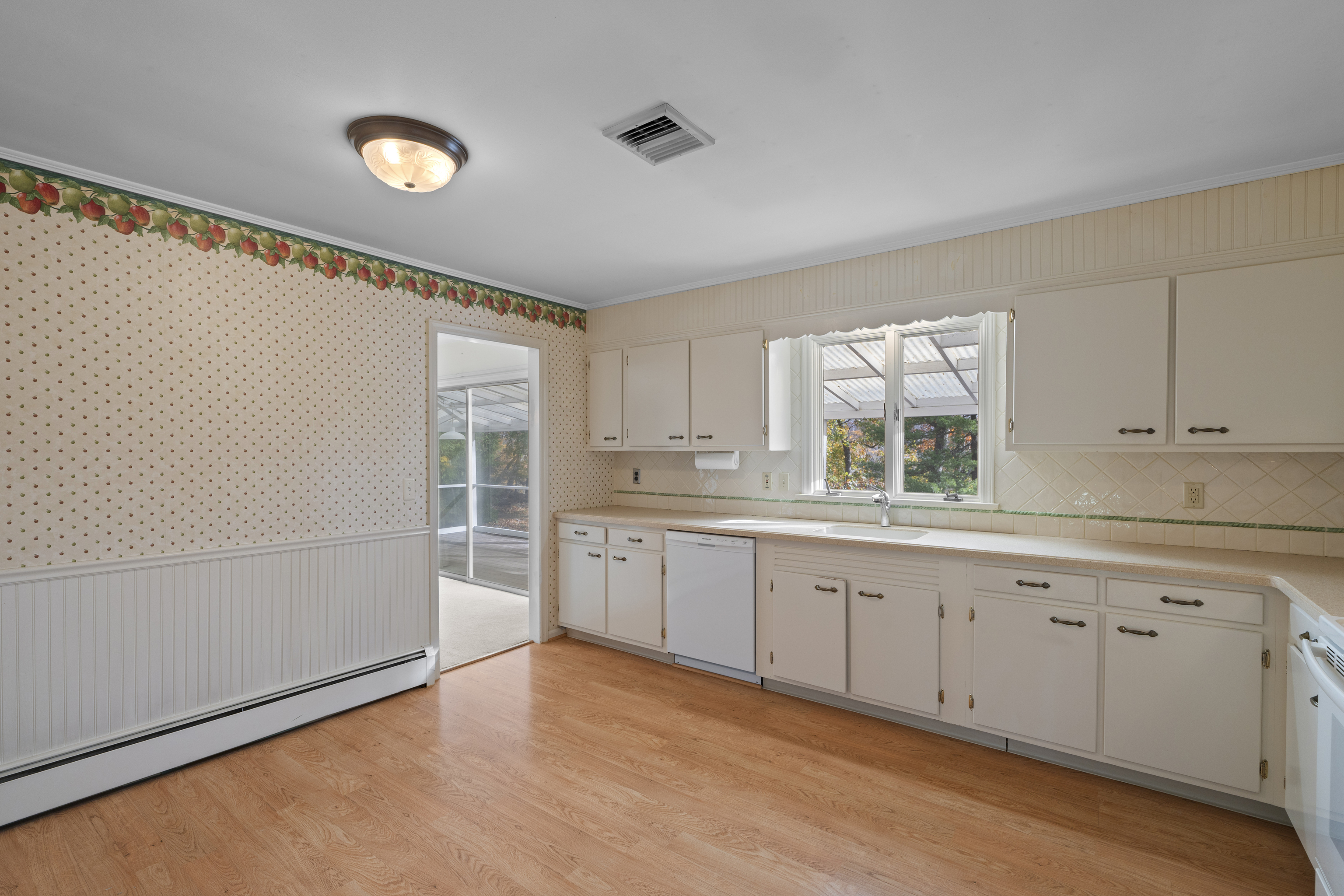 3 Parsell Lane Westport, CT 06880 - Photo 8 of 29 a kitchen with granite countertop white cabinets and white appliances