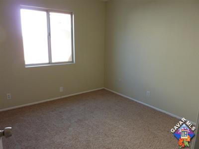 1539 Kings Road Palmdale, CA 93551 - Photo 13 of 22 an empty room with a window