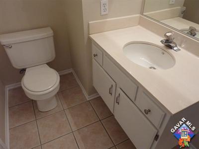 1539 Kings Road Palmdale, CA 93551 - Photo 17 of 22 a bathroom with a sink and a toilet