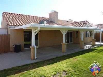 1539 Kings Road Palmdale, CA 93551 - Photo 20 of 22 a front view of a house with a yard