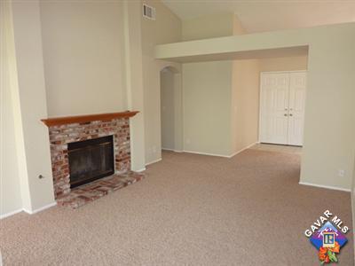 1539 Kings Road Palmdale, CA 93551 - Photo 6 of 22 a view of an empty room with a fireplace