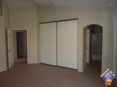 1539 Kings Road Palmdale, CA 93551 - Photo 10 of 22 a view of hallway with stairs and a closet