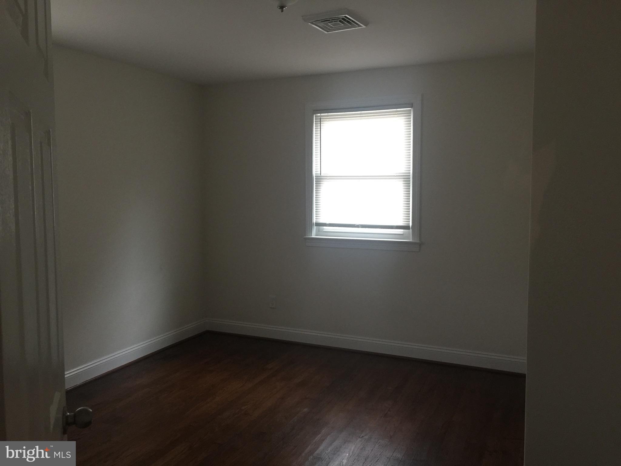 9101 Sudley Road Manassas, VA 20110 - Photo 2 of 16 an empty room with a window