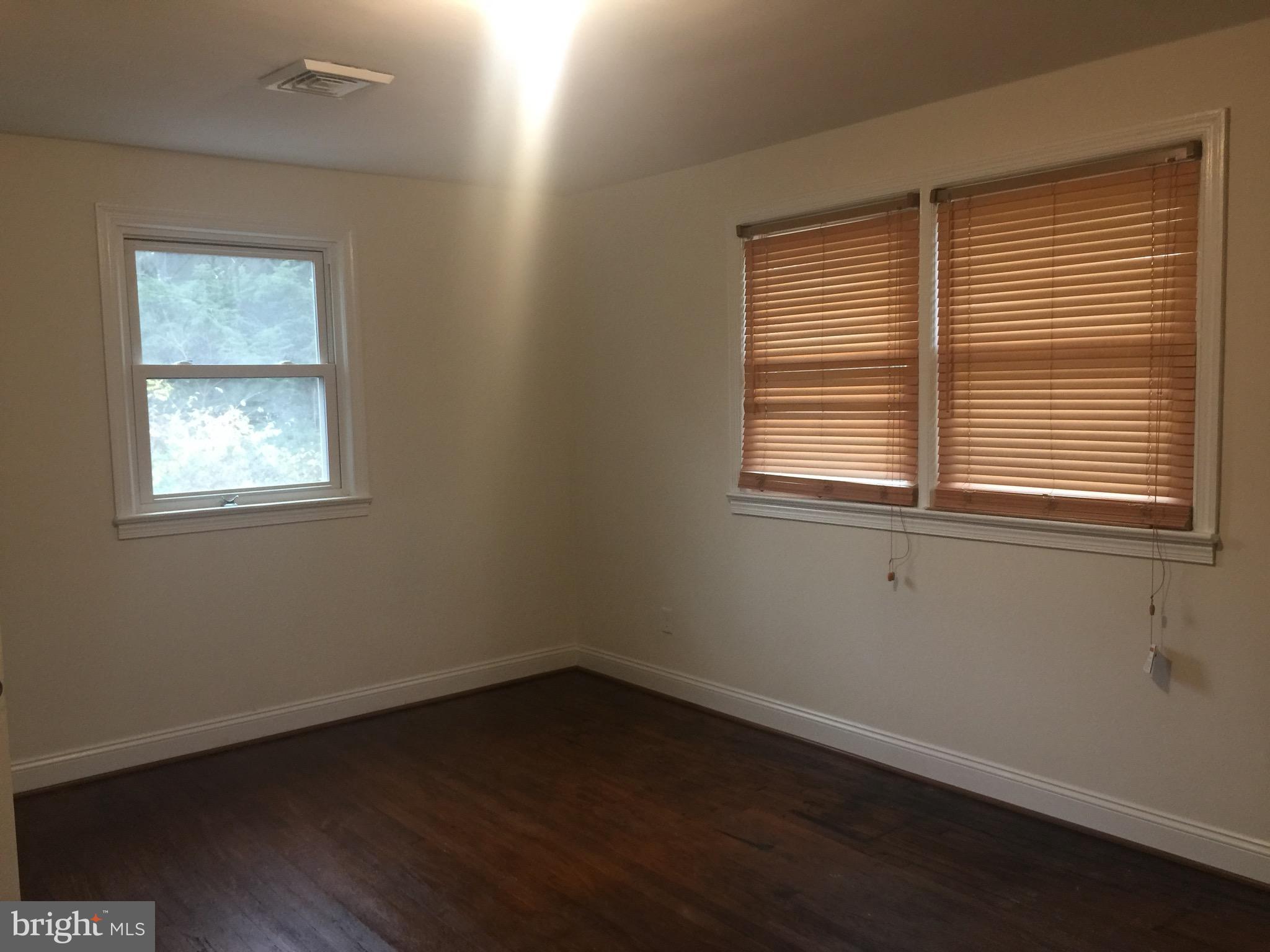 9101 Sudley Road Manassas, VA 20110 - Photo 3 of 16 an empty room with a window