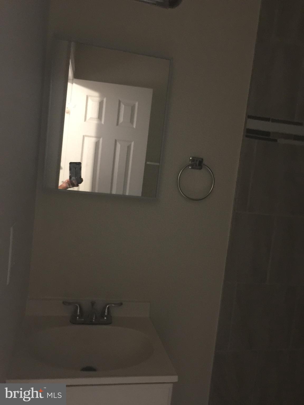 9101 Sudley Road Manassas, VA 20110 - Photo 5 of 16 a bathroom with a window