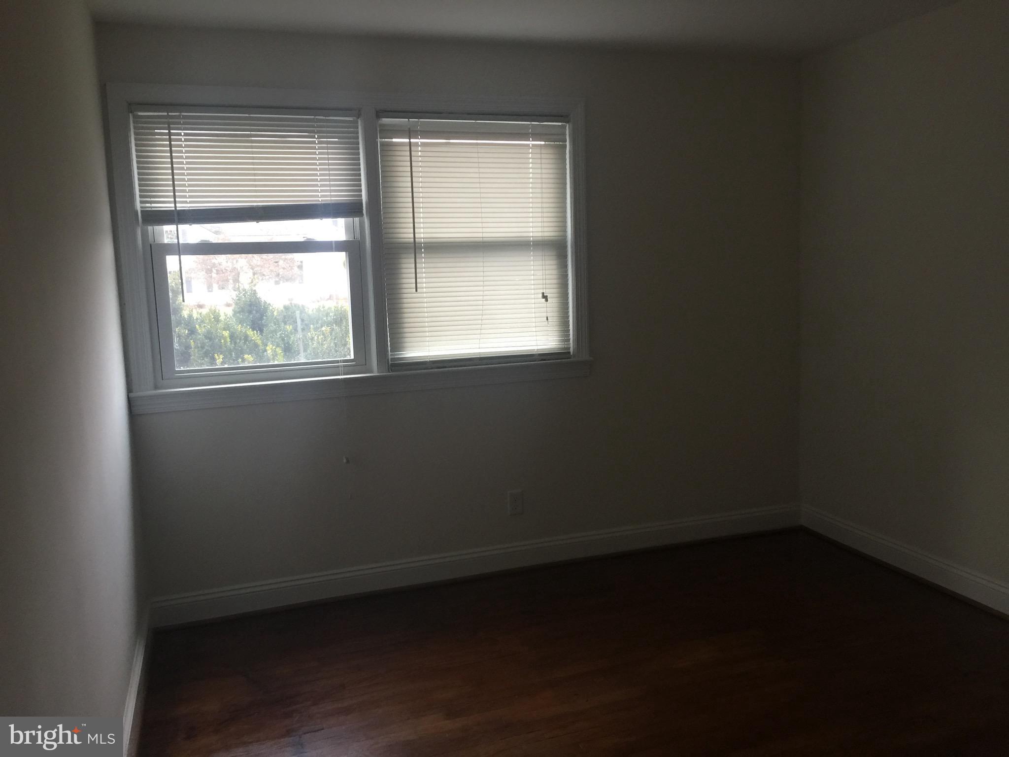 9101 Sudley Road Manassas, VA 20110 - Photo 7 of 16 an empty room with a window
