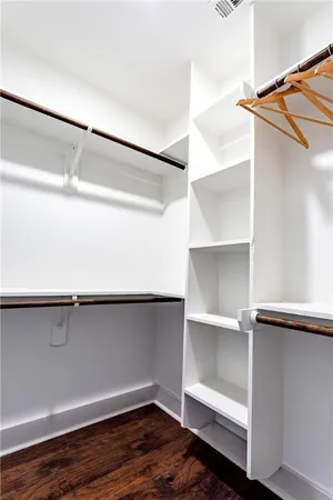 a bedroom with a bed window and a table