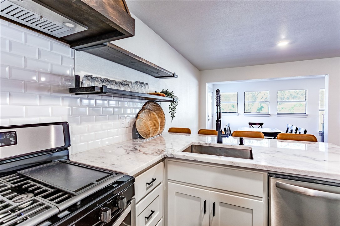 107 Spring Creek Street Waco, TX 76705 - Photo 40 of 78 a kitchen with a stove and a sink