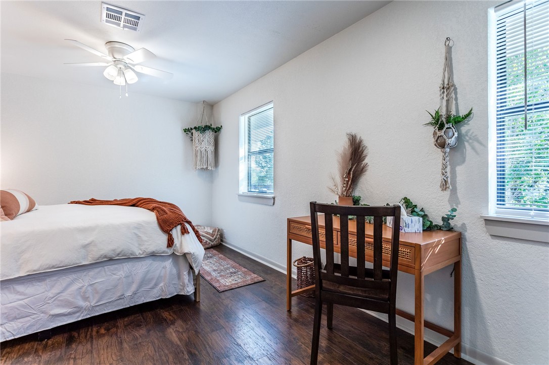 107 Spring Creek Street Waco, TX 76705 - Photo 56 of 78 a bedroom with a bed window and a table