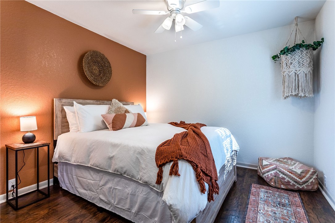 107 Spring Creek Street Waco, TX 76705 - Photo 57 of 78 a bedroom with a bed and painting on the wall