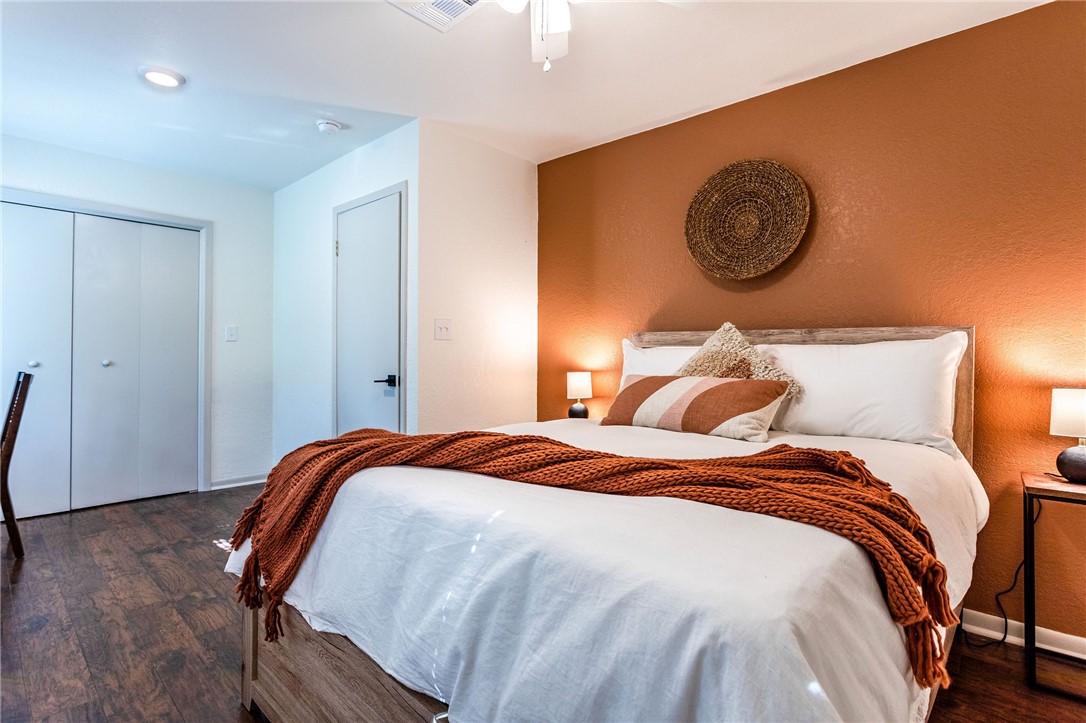 107 Spring Creek Street Waco, TX 76705 - Photo 59 of 78 a bedroom with a bed and painting on the wall