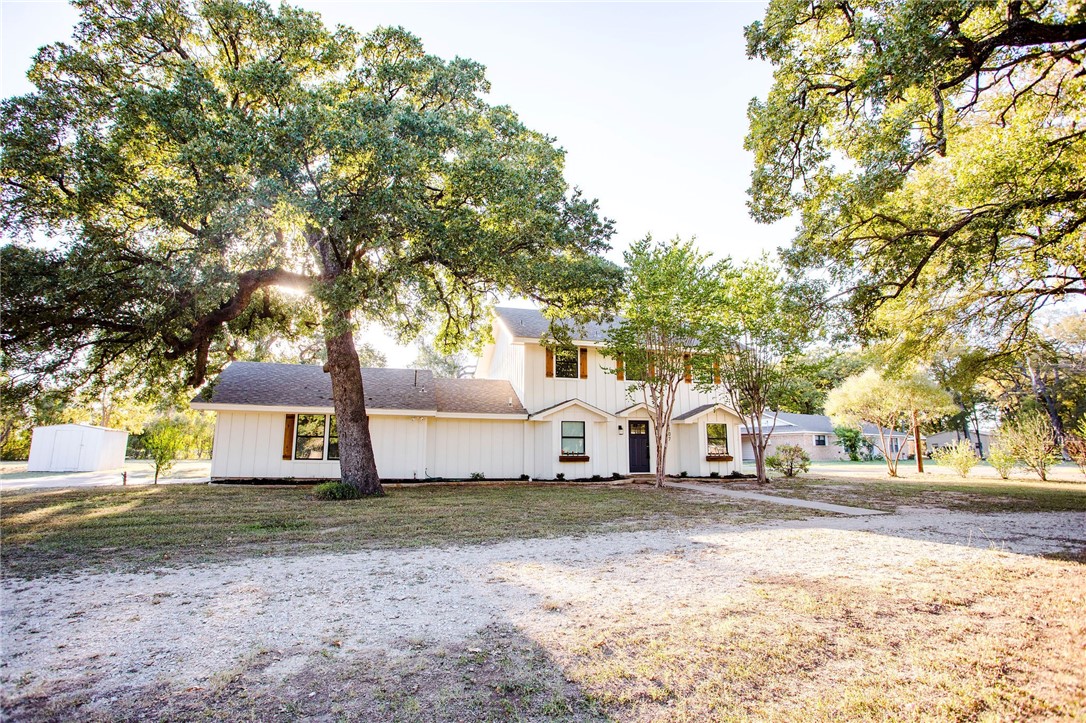 107 Spring Creek Street Waco, TX 76705 - Photo 7 of 78 a view of white house with a big yard and large tree