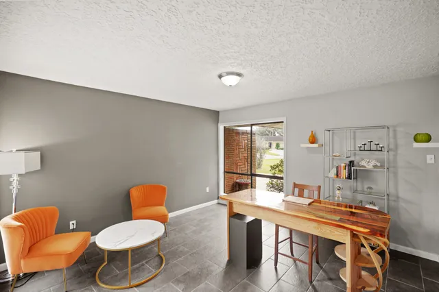 a room with furniture and a bathroom