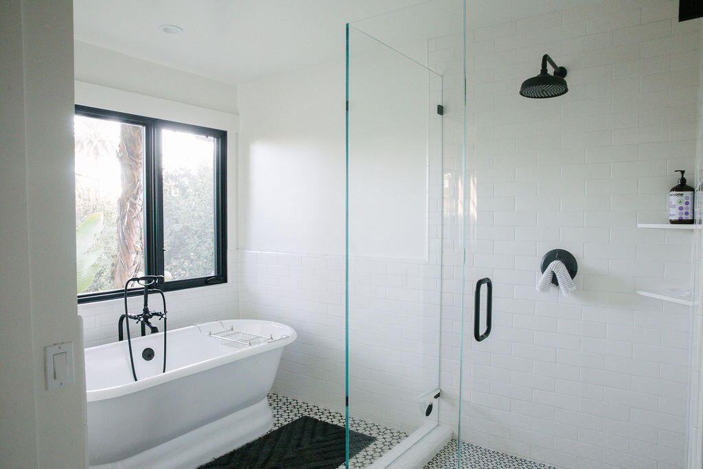 4140 Marina Drive Santa Barbara, CA 93110 - Photo 47 of 80 a bathroom with a tub a sink and mirror