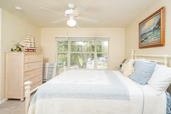 a room with gym equipment and floor to ceiling window