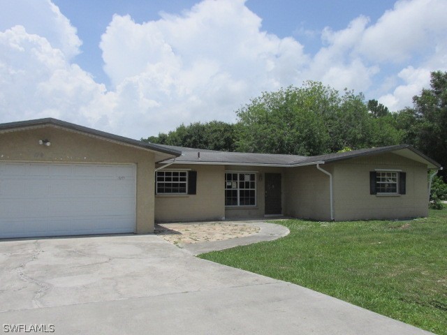 19185 Coconut Road Fort Myers, FL 33967 - Photo 1 of 13 front view of house with a yard