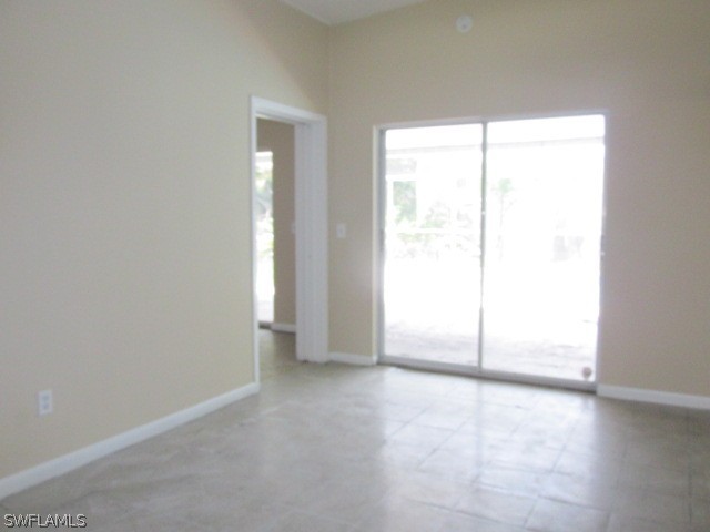 19185 Coconut Road Fort Myers, FL 33967 - Photo 6 of 13 an empty room with windows and closet