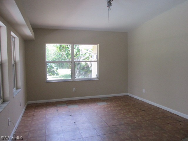 19185 Coconut Road Fort Myers, FL 33967 - Photo 9 of 13 an empty room with windows
