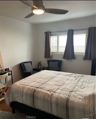 a bedroom with a bed and window