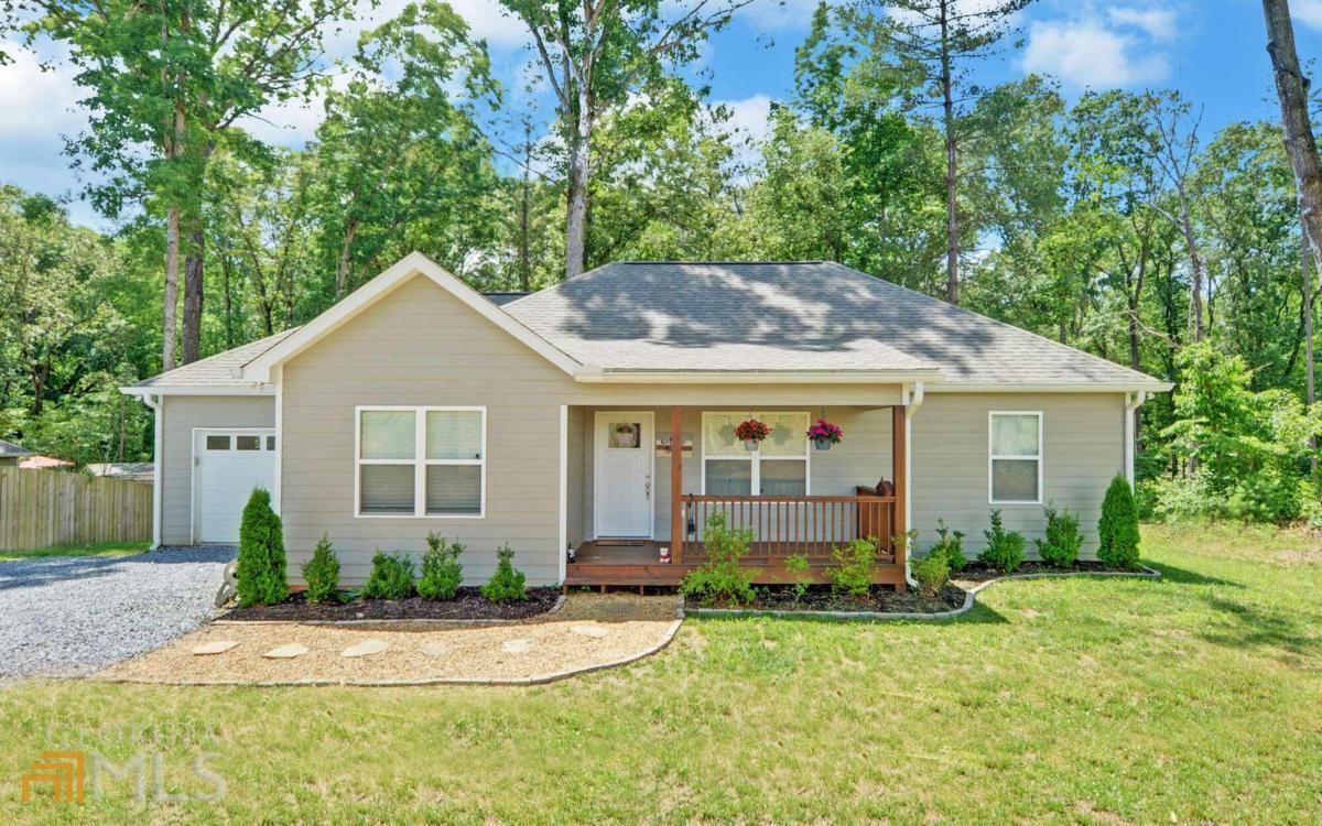 4670 Yukon Road, Unit 2 Ellijay, GA 30536 - Photo 1 of 1 a view of a house with yard and plants