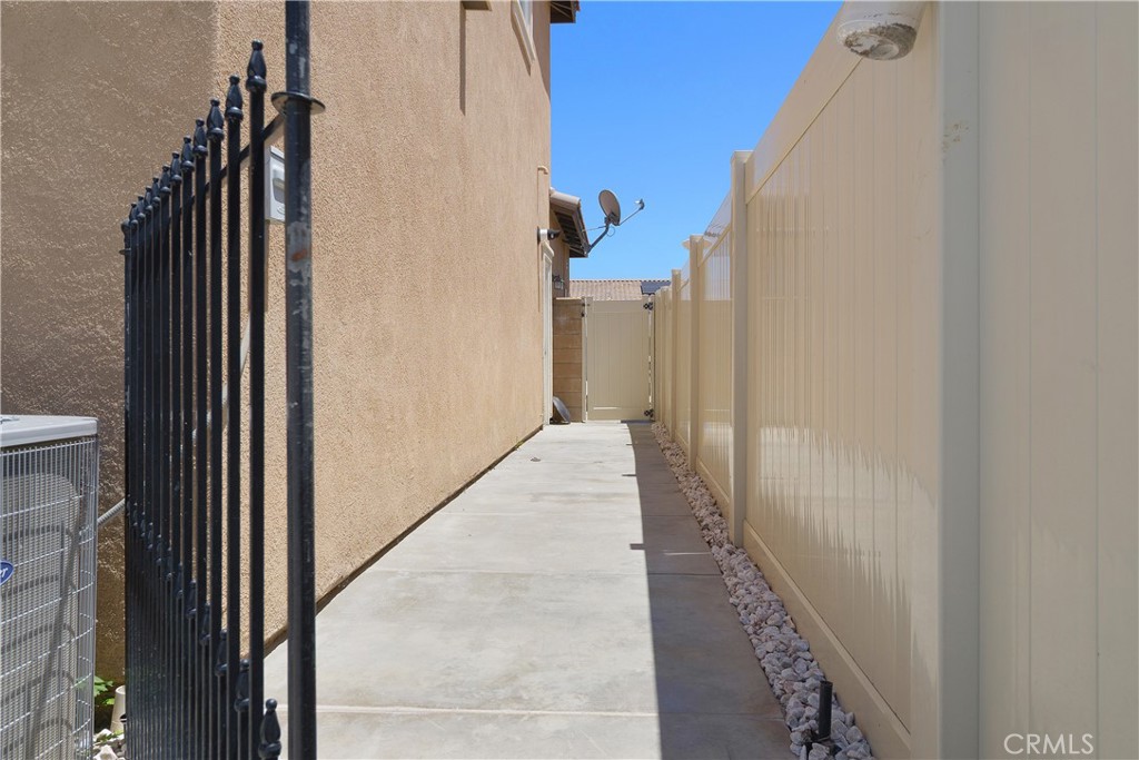 34727 Ribbon Grass Way Murrieta, CA 92563 - Photo 32 of 54 Side yard thoughtfully designed as a dedicated dog run—perfect for pets to play and roam