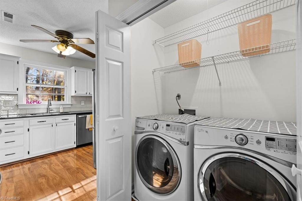 3329 Cardinal Ridge Drive Greensboro, NC 27410 - Photo 16 of 45 Laundry is conveniently located next to the kitchen.
