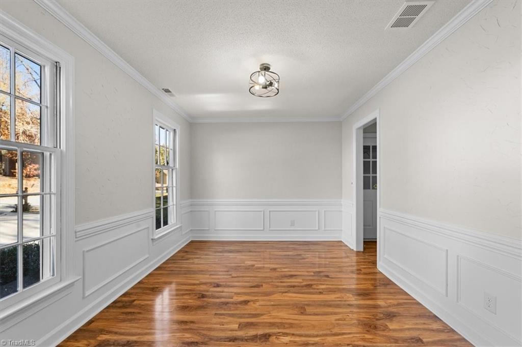 3329 Cardinal Ridge Drive Greensboro, NC 27410 - Photo 17 of 45 This space can be used as a formal dining room, a living room, or a downstairs office.
