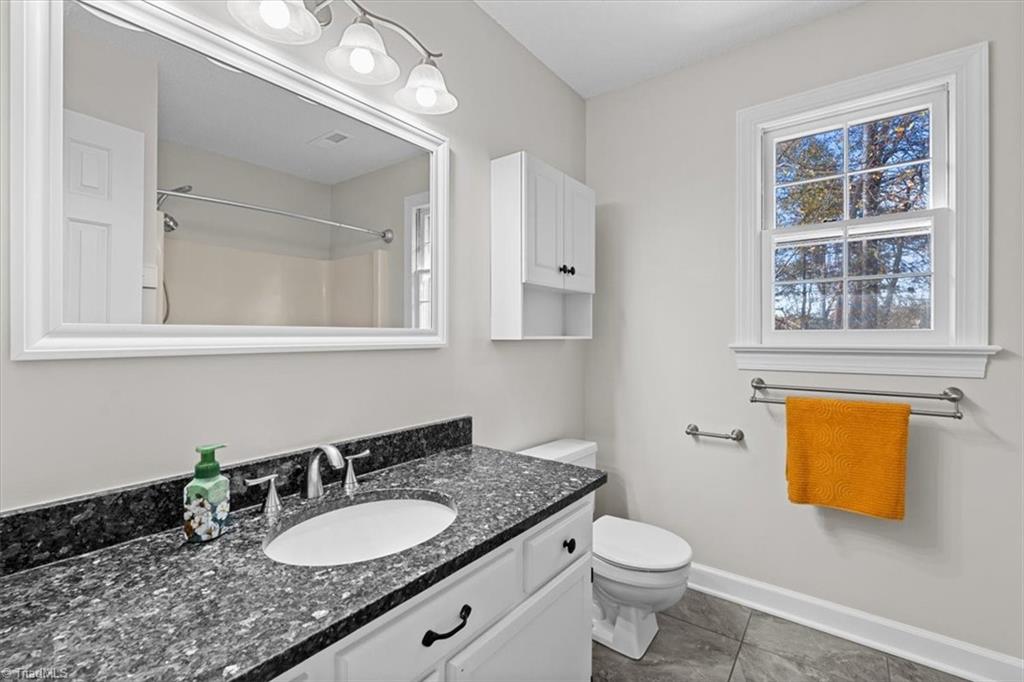 3329 Cardinal Ridge Drive Greensboro, NC 27410 - Photo 33 of 45 This is the hallway bathroom.