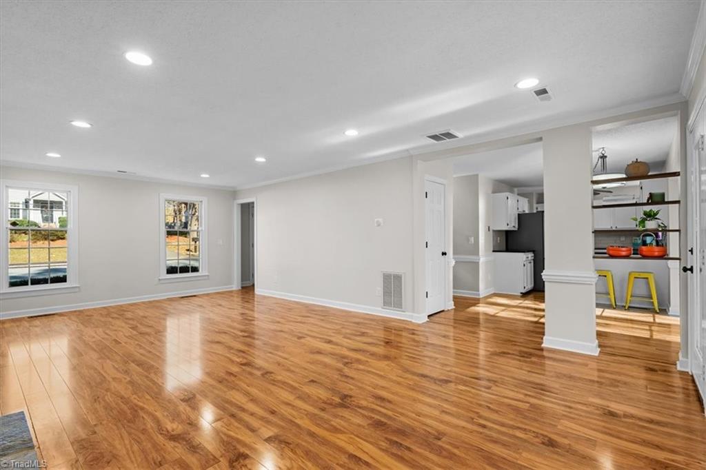 3329 Cardinal Ridge Drive Greensboro, NC 27410 - Photo 5 of 45 Great room opens to the sunroom and the kitchen providing perfect flow for entertaining indoors and outdoors.