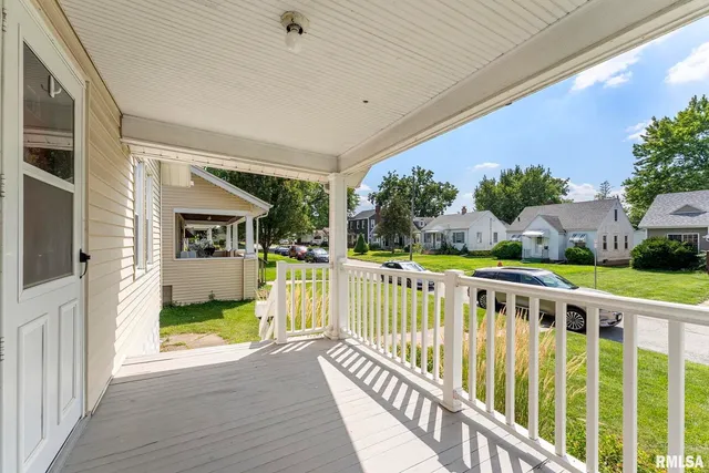 a view of a house with porch and wooden floor
