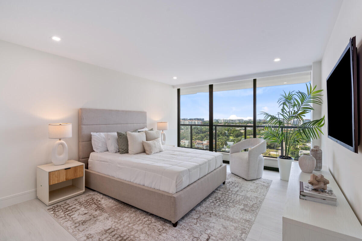 250 South Ocean Boulevard, Unit 11F Boca Raton, FL 33432 - Photo 13 of 45 a bedroom with a large bed and a flat screen tv