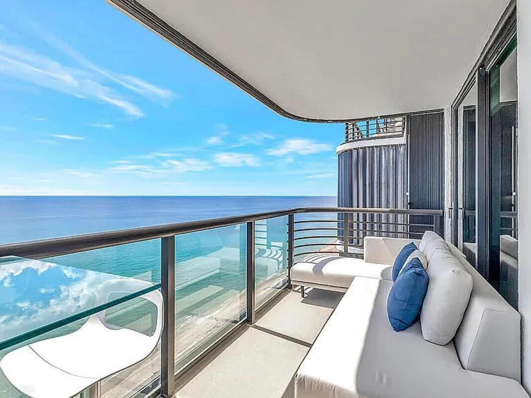 250 South Ocean Boulevard, Unit 11F Boca Raton, FL 33432 - Photo 17 of 45 a bedroom with furniture and a large window